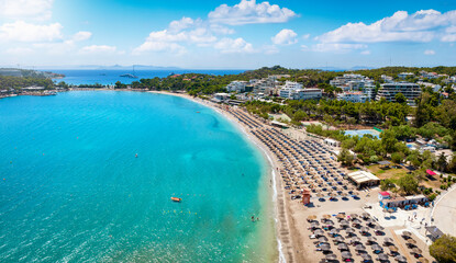 The beautiful beach of Vouliagmeni at the south Riviera of Athens, Greece, with emerald, clear sea and fine sand