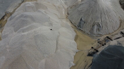 An aerial view of the piles of fine stone in the quarry. Fine stone is used in the production of quality asphalt for roads and for the preparation of concrete used in construction