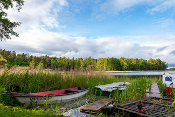 Rowing boats floating over the Lake Selment Wielki waters. Masuria, Mazury Lake District, Poland - obrazy, fototapety, plakaty