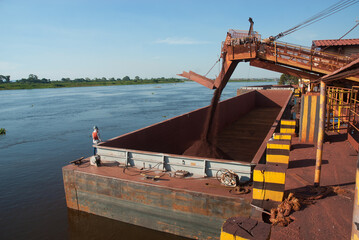 Corumbá, Brazil, August 7, 2006 Rio Paraguai - Barge being loaded with iron ore on the Paraguay River, in the region of Corumbá, Mato Grosso do Sul.