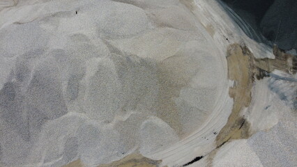An aerial view of the piles of fine stone in the quarry. Fine stone is used in the production of quality asphalt for roads and for the preparation of concrete used in construction