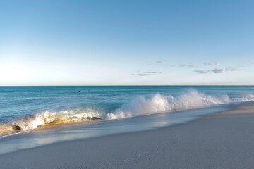 Waves crashing at a surf beach in Australia