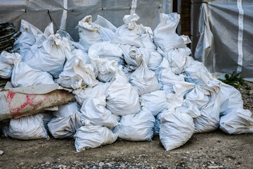 Construction waste. Garbage in the bags after the reconstruction of the apartment. Illegal dumping. Selective focus.