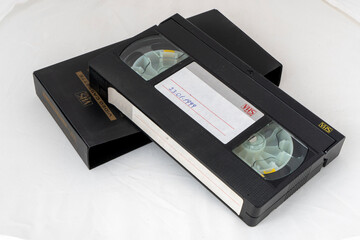 Old video cassette on white isolated backgorund with text space.