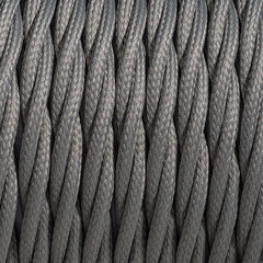 Colorful braided and shilded cable texture background. Closeup with visible texture