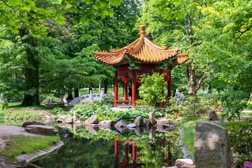 Traditional Chinese temple in forest or Lazienki park in Warsaw, Poland.