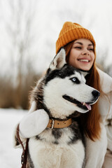 woman with a purebred dog outdoor games snow fun travel winter holidays