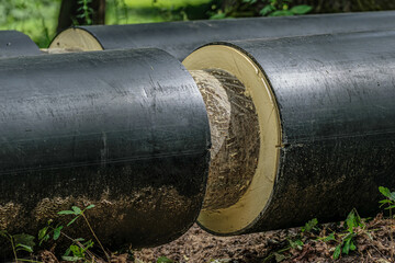 Laying pipes of large diameter. Large pipes with thermal insulation.