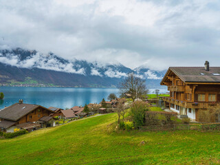 Traditional Swiss houses  on Lake Brienz in Iseltwald village, Switzerland