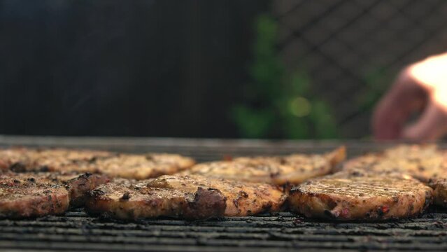 Spicy Pork Beef Bacon Being Grilled Over Bright Glowing Coals Broasting On Fire. Lunch celebration Party Barbecue. Outdoor Cooking. Cook Prepares Oriental Dish In Kitchen. Junk Food, Healthy Lifestyle