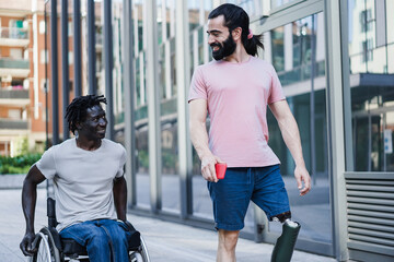 Multiracial friends with disability having fun outdoor - Focus on prosthetic leg