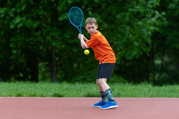 Fototapeta na wymiar Child with tennis racket on tennis court. Training for young kid, healthy children. Horizontal sport theme poster, greeting cards, headers, website and app