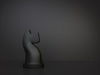 Black knight chess figurine on dark background