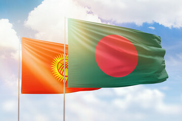 Sunny blue sky and flags of bangladesh and kyrgyzstan