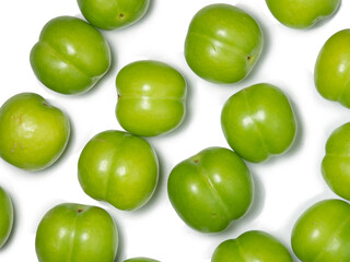Cherry plum fruits on a white background. Healthy green fruit. Southern fruit isolate.