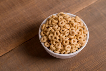 Cereal on Wood Surface in White Bowl
