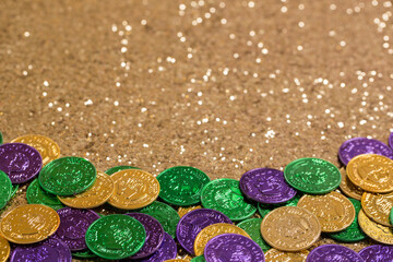 Mardi Gras Doubloons on a Gold Background