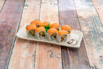 California uramaki sushi platter with Norwegian salmon, nori seaweed, avocado, cream cheese and Japanese rice