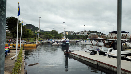 Yacht Club marina harbor ramp sea water bay vessel sailboat boat motorboat pier bench balcony restaurant bar parking cement path stone texture Rio de Janeiro