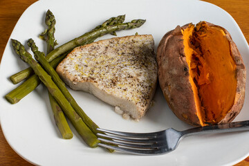 tuna steak season with pepper and salt served with sweet potato