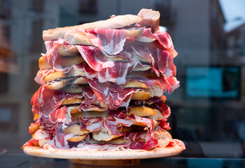 Sandwiches with Spanish ham on bar window in Madrid. Spain
