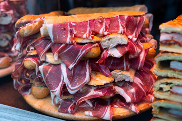 Sandwiches with Spanish ham on bar window in Madrid. Spain