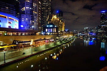 Fototapeta na wymiar City Night Scene with River and Bridge