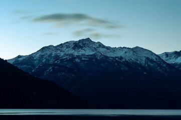 Snowy Andes mountain range hills during a sunrise. Los Alerces National Park