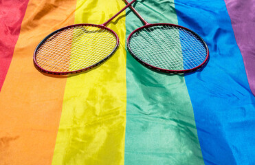 Badminton rackets on LGBTQ rainbow flag