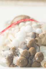 Organic shiitake or shiitake mushrooms grown in a farmer's mushroom farm grown for sale and exported abroad is a healthy vegetarian food that farmers package to sell in the vegetable market