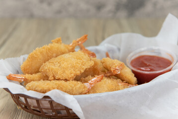 Delicious basket of fried shimp for an appetizer of a seafood meal