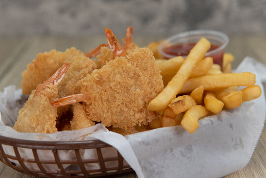 Delicious basket of fried shrimp and chips for a hearty
 seafood meal
