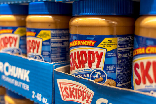 Skippy Super Chunk Peanut Butter for sale at an aisle of a supermarket.