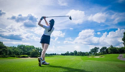 Foto op Canvas Professional woman golfer teeing golf in golf tournament competition at golf course for winner   © APstudio