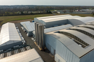 Aerial view of modern factory structure for production and distribution of industrial equipment. Concept of global industry