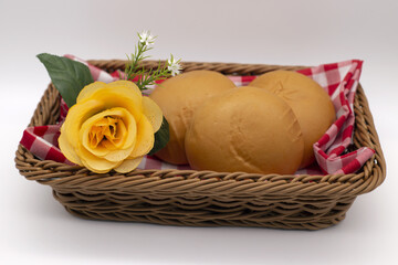 Bread in a basket and flowers,Include Clipping Path.