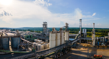 Aerial view of oil and gas refining petrochemical factory with tall refinery plant manufacture structure