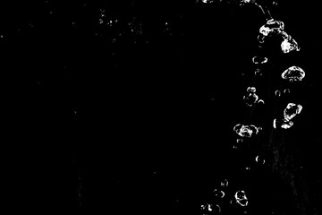 Obraz premium water splashes isolated on black background. white jets with drops