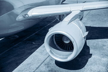 Fototapeta premium Concept Industrial repair and maintenance of aircraft engine of airplane, blue color toning