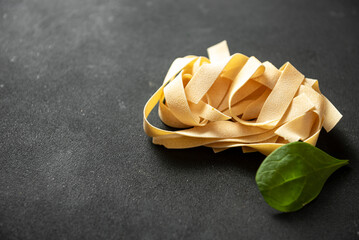 pasta, Pappardelle are large, very broad, flat pasta, similar to wide fettuccine, originating from...