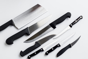 Unused,new knife set of different knives designed on white surface..Conceptual image