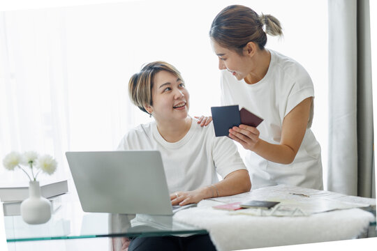 Happy Lgbt Gay Couple Of Asian Women Having Fun Using A Computer Laptop At Home - LGBT Lesbian Relationship, Asian LGBTQ Female Lesbian Concept.