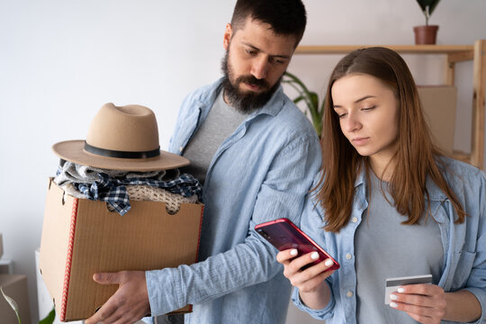 entrepreneur SME freelance young woman holding credit card and smartphone with box, couple moving to new home buying furniture, online marketing packaging mail box and delivery, SME e-commerce