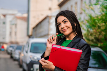 pensive latin hispanic student woman in the street