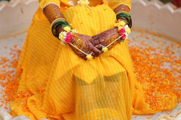 Hands and Yellow Petals Decoration For Bride in Haldi Ceremony. 