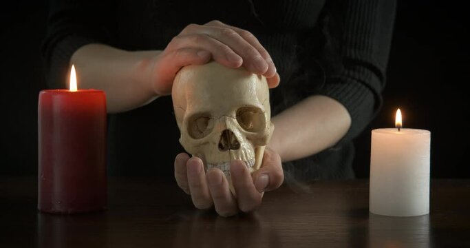 Fortune teller with a skull in her hands.