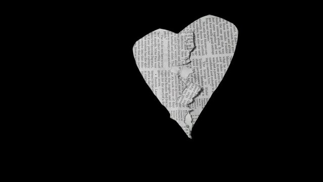 Heartbreak.broken heart stop-motion animation of newspaper loop. More elements in our portfolio.