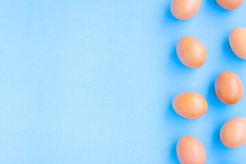 Chicken Eggs on blue with grain background