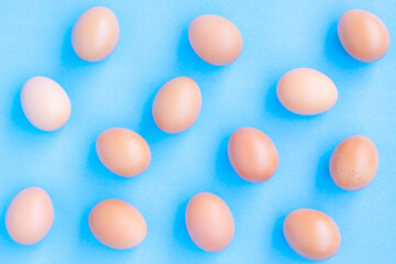 Chicken Eggs on blue with grain background