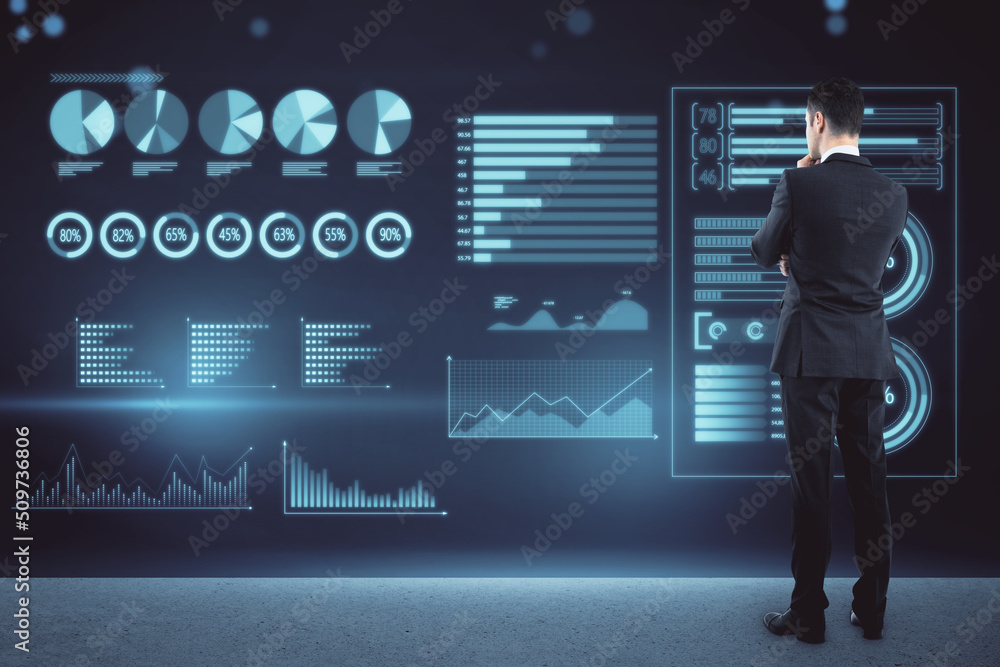 Poster businessman standing on abstract glowing background with blue business charts and graphs hologram. f
